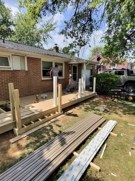TimberTech composite deck boards being installed with railing posts in place — Richland, PA