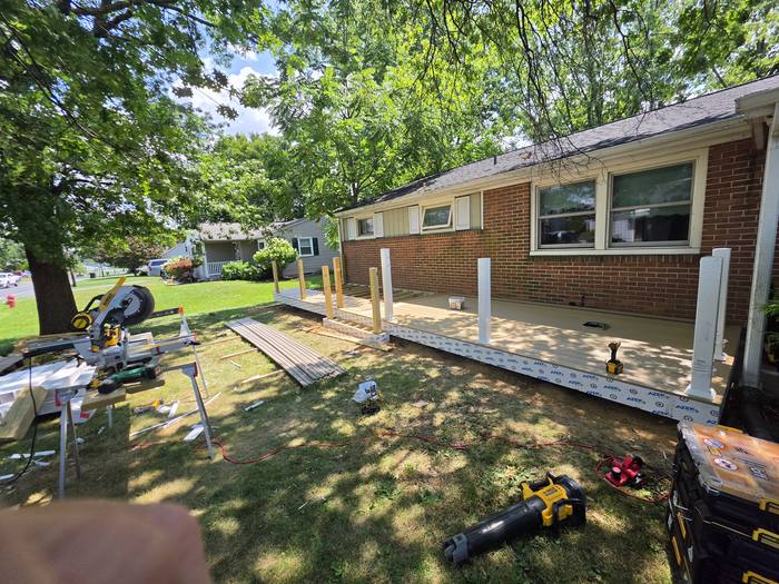 Composite decking installation in progress with cut station on site — Richland, PA